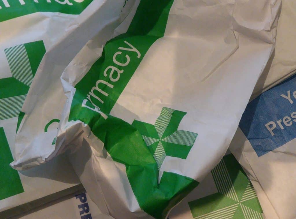 A variety of prescription bags of various shapes, sizes and conditions