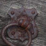 A rusted old door latch